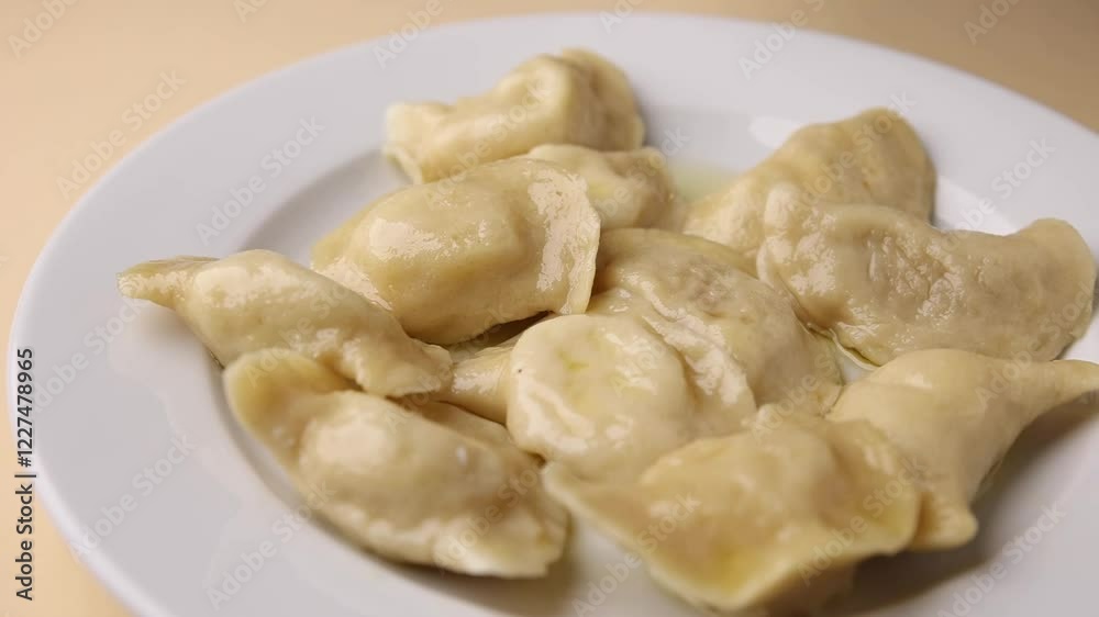 Ukrainian dumplings. On a white plate. Close-up. Ukrainian dumplings. On a white plate. Close-up.