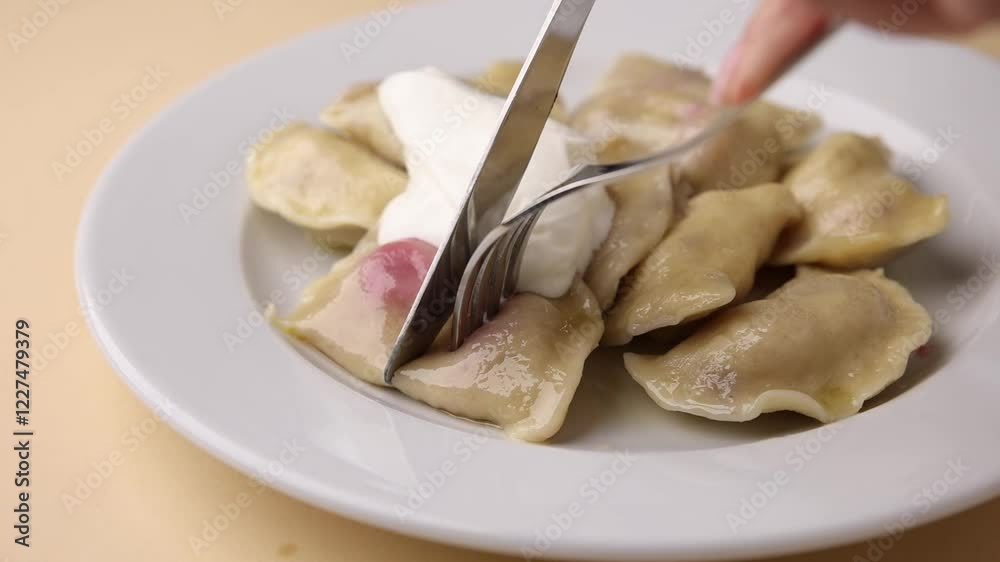 Ukrainian dumplings. On a white plate. Close-up. Ukrainian dumplings. On a white plate. Close-up.