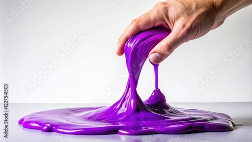 Purple slime being manipulated by a squirmy finger, craft supplies, art materials, tactile, messy play photo