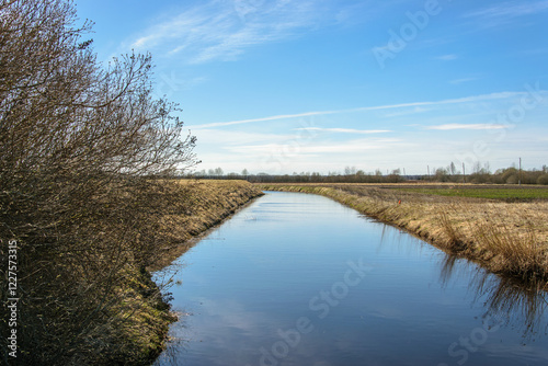 Irrigation channel between cultivated fields.