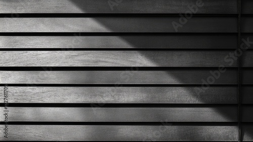 Horizontal Window Blinds Closed with Soft Light and Shadows Creating Textured Patterns on Surface