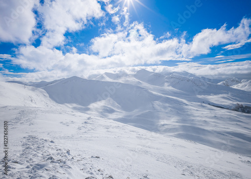 Obraz na płótnie Campo Felice, Italy - The suggestive plateau peak in Abruzzo region, Monte Puzzillo and Morretano summit mount range, during the winter with snow and alpinists in altitude w salonie