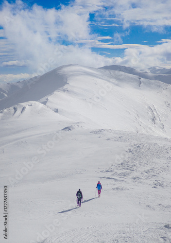 Obraz na płótnie Campo Felice, Italy - The suggestive plateau peak in Abruzzo region, Monte Puzzillo and Morretano summit mount range, during the winter with snow and alpinists in altitude w salonie
