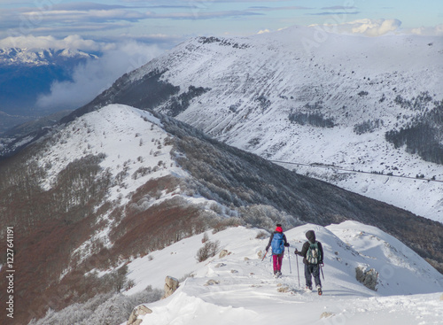 Obraz na płótnie Campo Felice, Italy - The suggestive plateau peak in Abruzzo region, Monte Puzzillo and Morretano summit mount range, during the winter with snow and alpinists in altitude w salonie