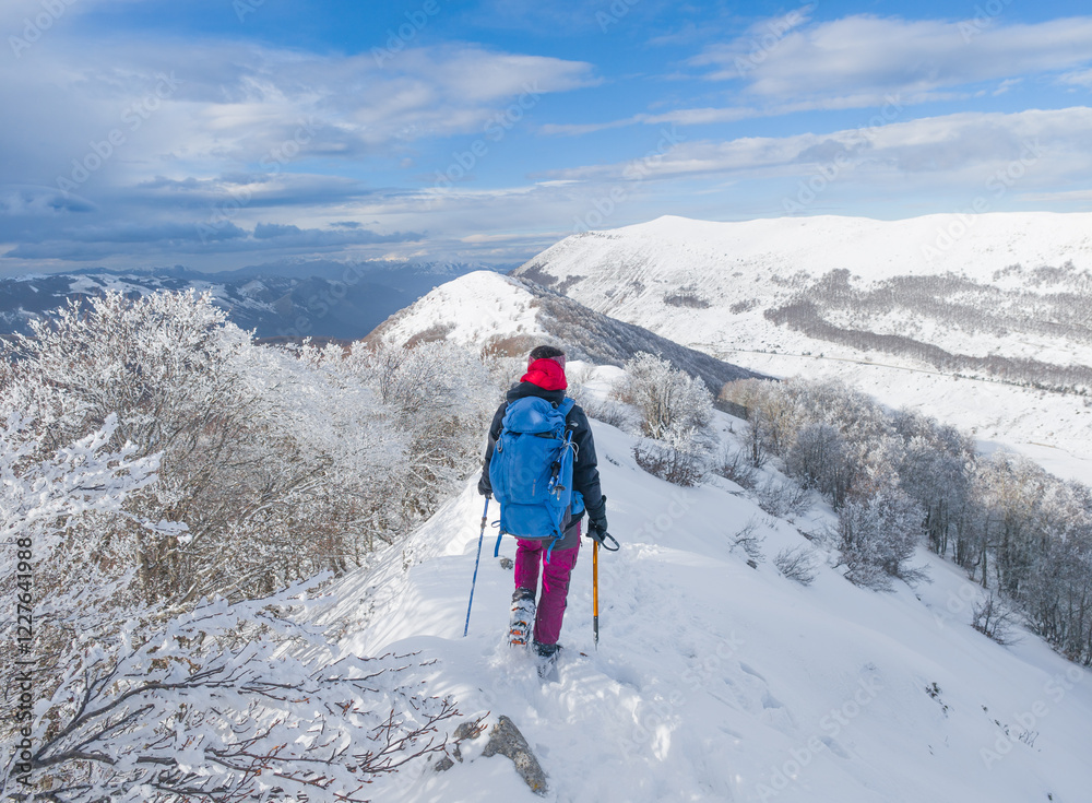 Campo Felice, Italy - The suggestive plateau peak in Abruzzo region, Monte Puzzillo and Morretano summit mount range, during the winter with snow and alpinists in altitude Campo Felice, Italy - The suggestive plateau peak in Abruzzo region, Monte Puzzillo and Morretano summit mount range, during the winter with snow and alpinists in altitude