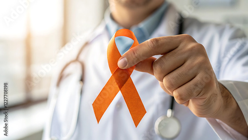 Doctor supporting leukemia awareness with orange ribbon focused on health advocacy.
