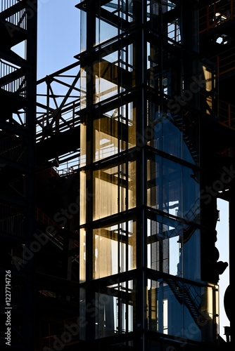 reflective glass elevator in a factory