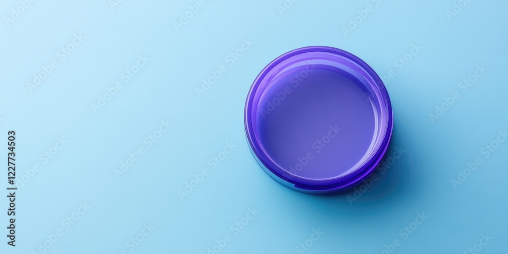 Obraz premium Empty purple medical container on a blue tabletop creating ample copy space for health-related messages or product advertisements.