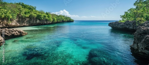 Tranquil lagoon waters surrounded by lush greenery and clear skies ideal for relaxation and vacation imagery with space for text. photo