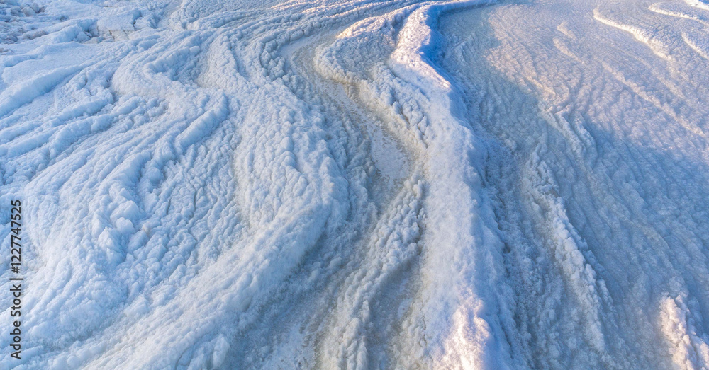 Fototapeta premium Abstract natural textured background of snowy ice surface sea.