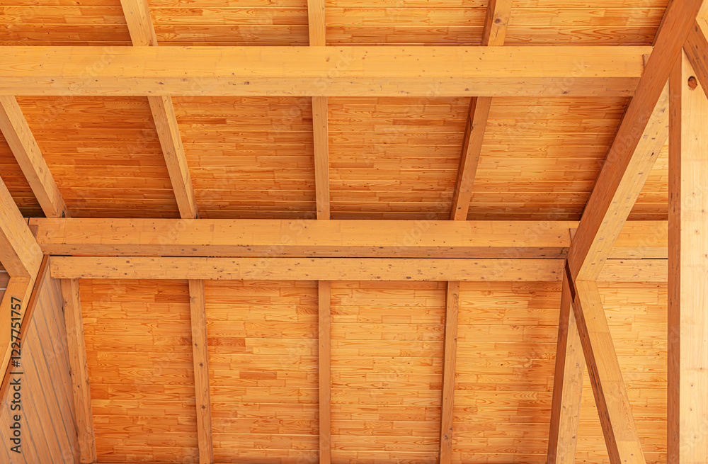 Construction of a wooden roof of a frame house.