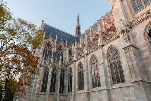 Photography Spire and facade part of Votive Church at sunset, Vienna