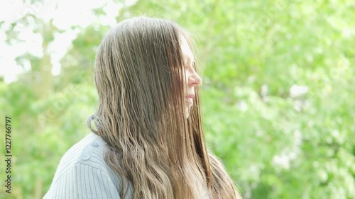 older woman with greasy, graying hair hanging in limp clumps, concept hair loss, health haircut care, hormonal imbalance