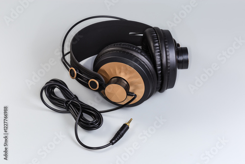 Wired full size headphones on a gray background photo