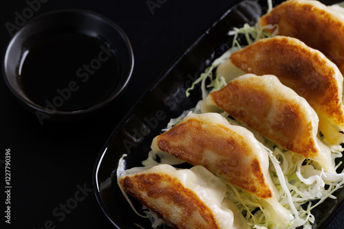 Gyoza Japanese food dumpling isolated in black background
