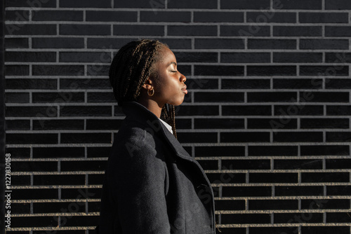 African American businesswoman with braids on a break outdoors