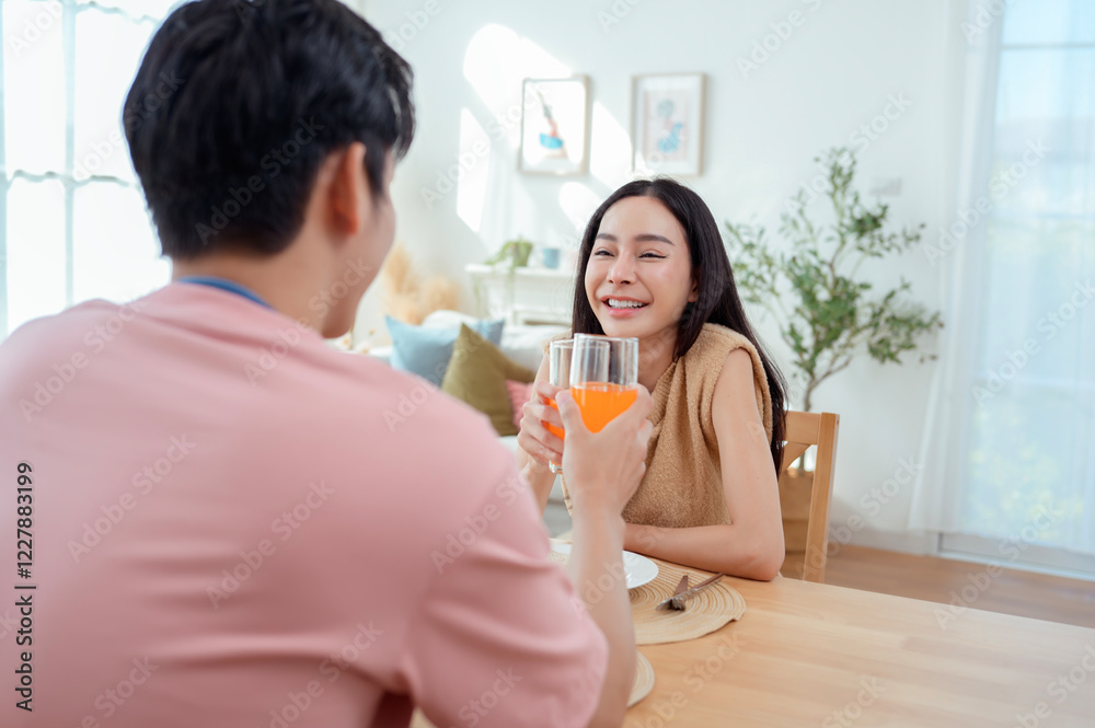Couple Enjoys a Cheerful Breakfast at a Bright, Modern Dining Table in a Cozy Home Setting Couple Enjoys a Cheerful Breakfast at a Bright, Modern Dining Table in a Cozy Home Setting