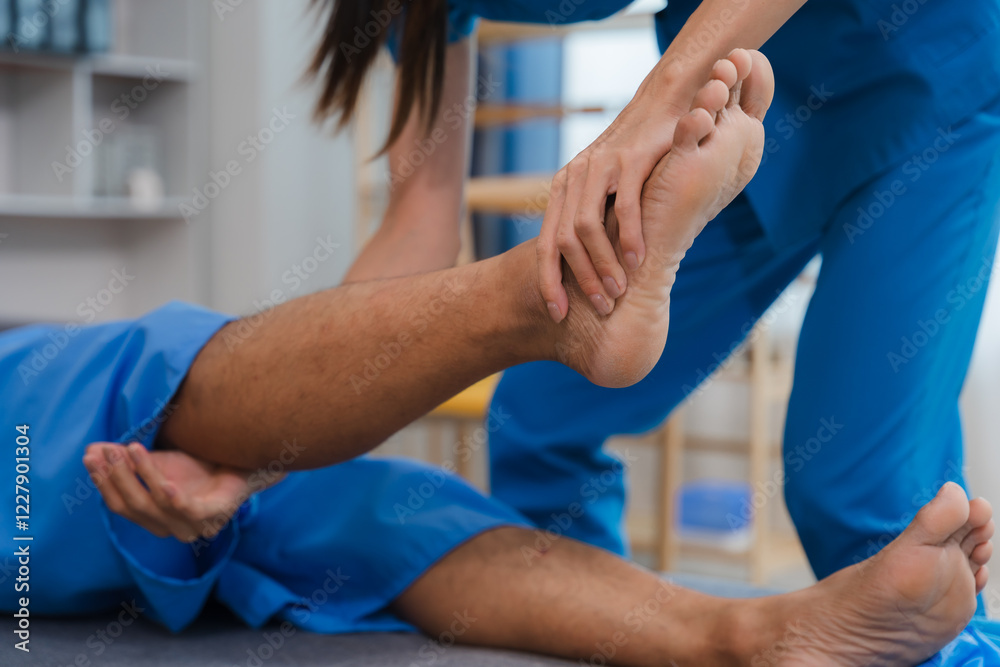 Obraz premium Physical Therapy Focus: Close-up shot of a physical therapist examining a patient's foot and leg, showcasing the dedicated care and attention to detail in rehabilitation.