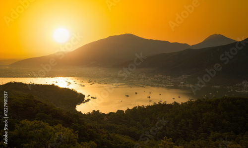 Fototapeta Naklejka Na Ścianę i Meble -  Wonderful view of Fethiye city centre at sunrise. Mugla city, Turkey country