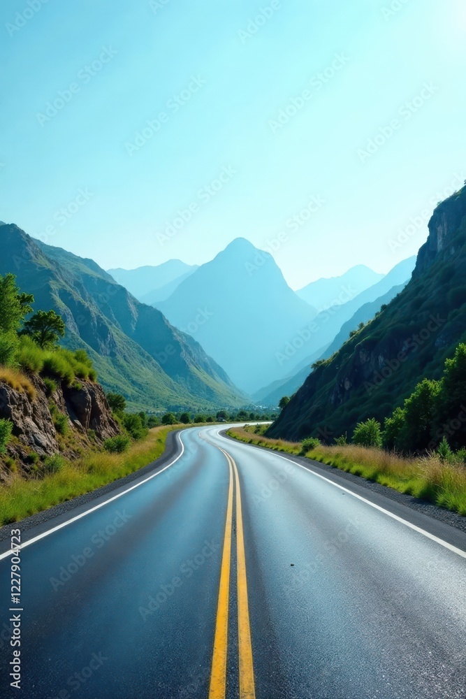 Naklejka premium Asphalt ribbon unwinding through a majestic mountain valley under a brilliant, clear sky, promising adventure and exploration on a scenic journey ahead