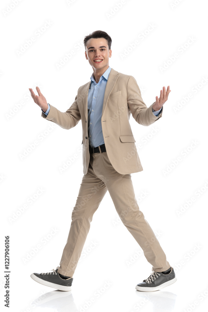 young business student walking to side and making hello gesture young business student walking to side and making hello gesture