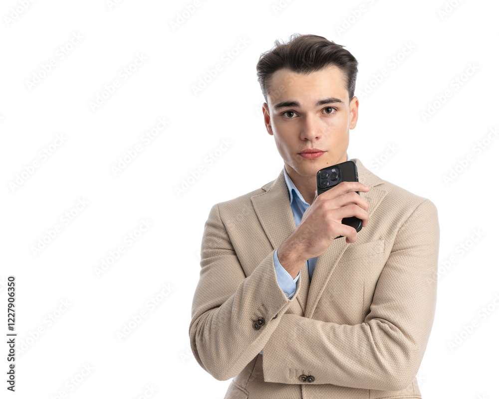 sexy smart casual man holding phone and arms folded sexy smart casual man holding phone and arms folded