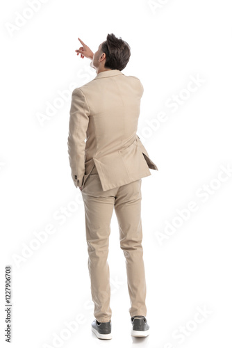 behind of smart casual man pointing finger up to side photo