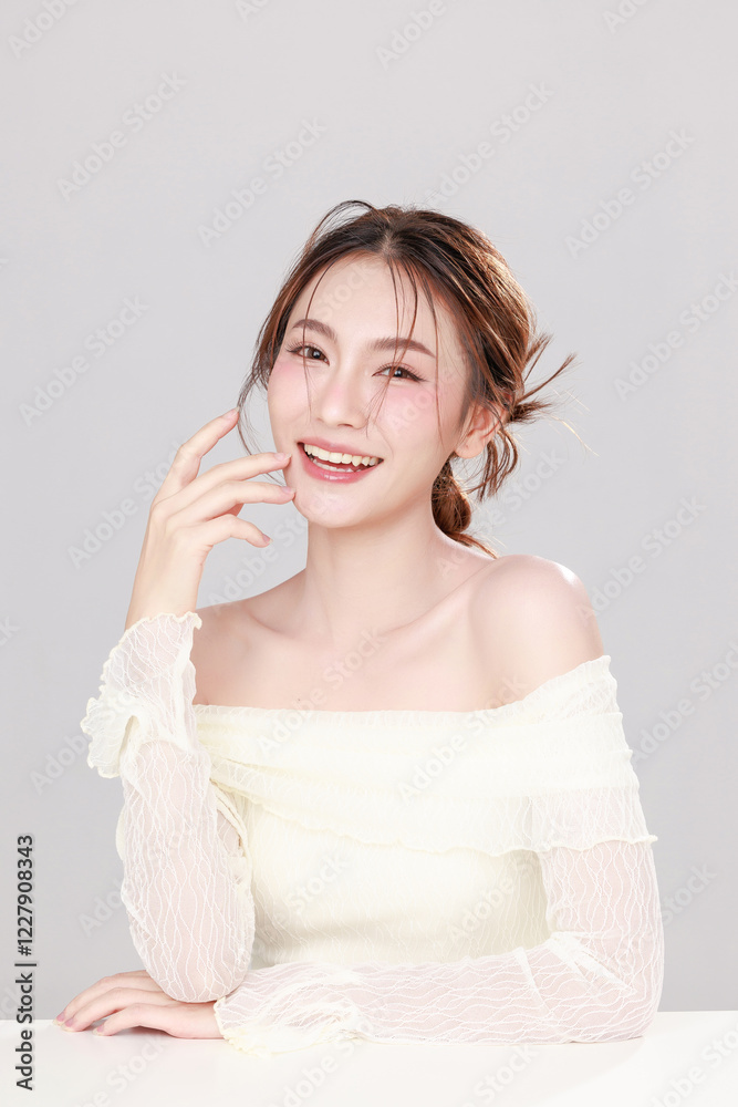 Portraits of young Asian woman K beauty natural makeup face with clean fresh skin on gray background, Facial and skin care concept for commercial advertising. Portraits of young Asian woman K beauty natural makeup face with clean fresh skin on gray background, Facial and skin care concept for commercial advertising.
