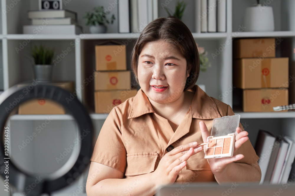E-commerce entrepreneur demonstrating eyeshadow palette on camera, engaging audience from home office E-commerce entrepreneur demonstrating eyeshadow palette on camera, engaging audience from home office