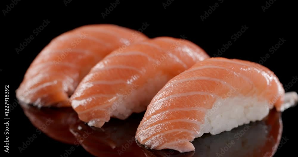 dive in the authentic Japanese flavours with pink raw salmon and rice made in nigiri sushi creating the perfect Japanese delicacy dive in the authentic Japanese flavours with pink raw salmon and rice made in nigiri sushi creating the perfect Japanese delicacy