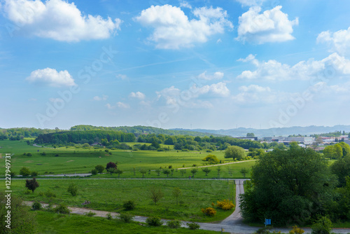 Landscape view from the tower in Sauerland Park Hemer in summer. White clouds drift across the blue sky above the green hills of Germany. photo