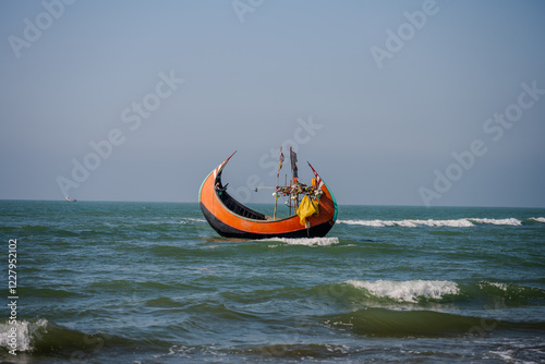Slika na platnu Traditional Wooden Fishing Boat on the Waves of the Bay of Bengal, Cox's Bazar,