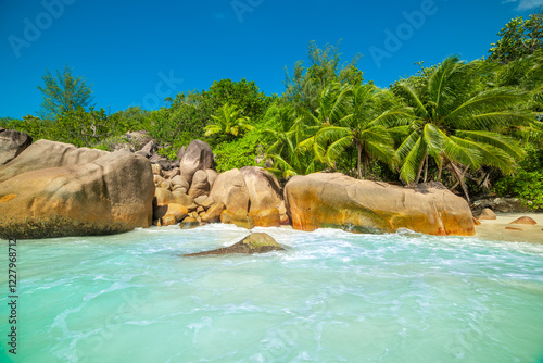 Granite boulders and turquoise water in a tropical beach