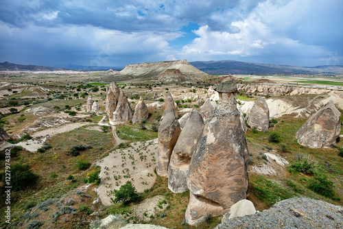 Obraz na płótnie Unique rock formations rise majestically under a dramatic sky in a scenic landscape w salonie