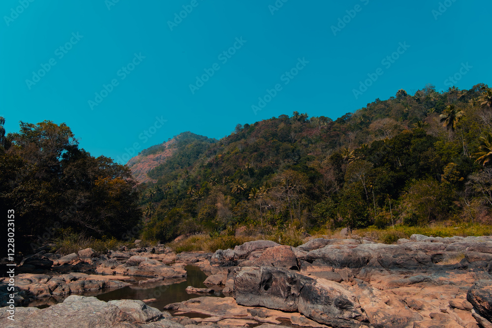 Mountain landscape with river and blue sky background