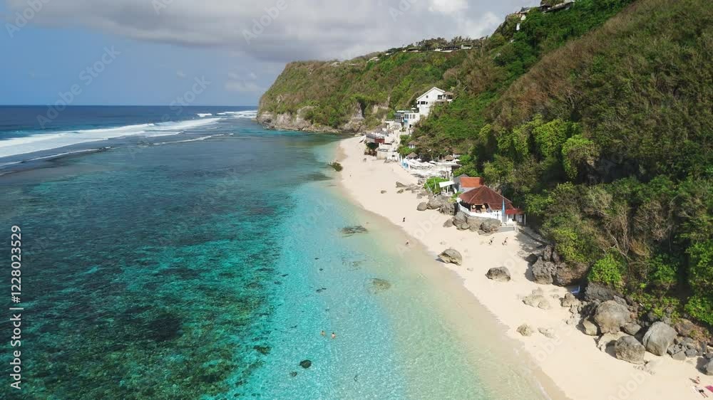 Scenic landscape with mountain coastline and idyllic tropical beach with blue ocean. Aerial view with Melasti beach, Bali Scenic landscape with mountain coastline and idyllic tropical beach with blue ocean. Aerial view with Melasti beach, Bali