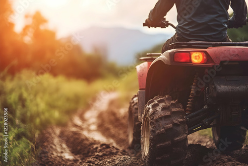 Man riding an ATV on a rugged off-road track, highlighting outdoor sports and adventure
