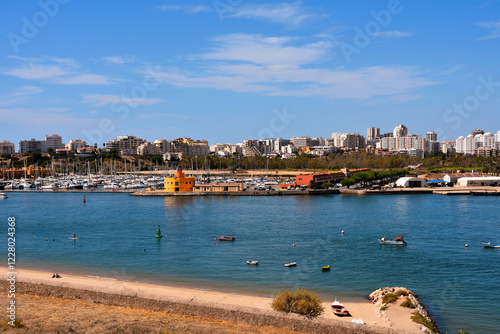 beach in ferragudo behind portimao algarve portugal photo
