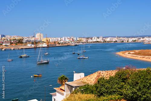 view of ferragudo and behind portimao algarve portugal photo