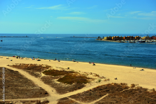 beach in ferragudo behind portimao algarve portugal photo