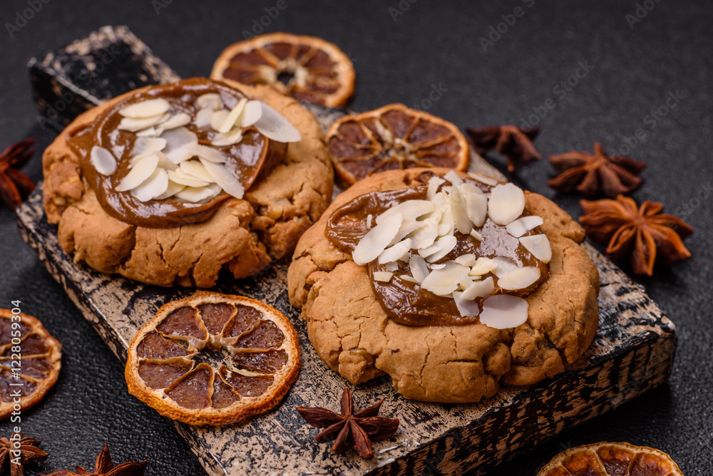 Fototapeta premium Round cookies with nuts and chocolate butter