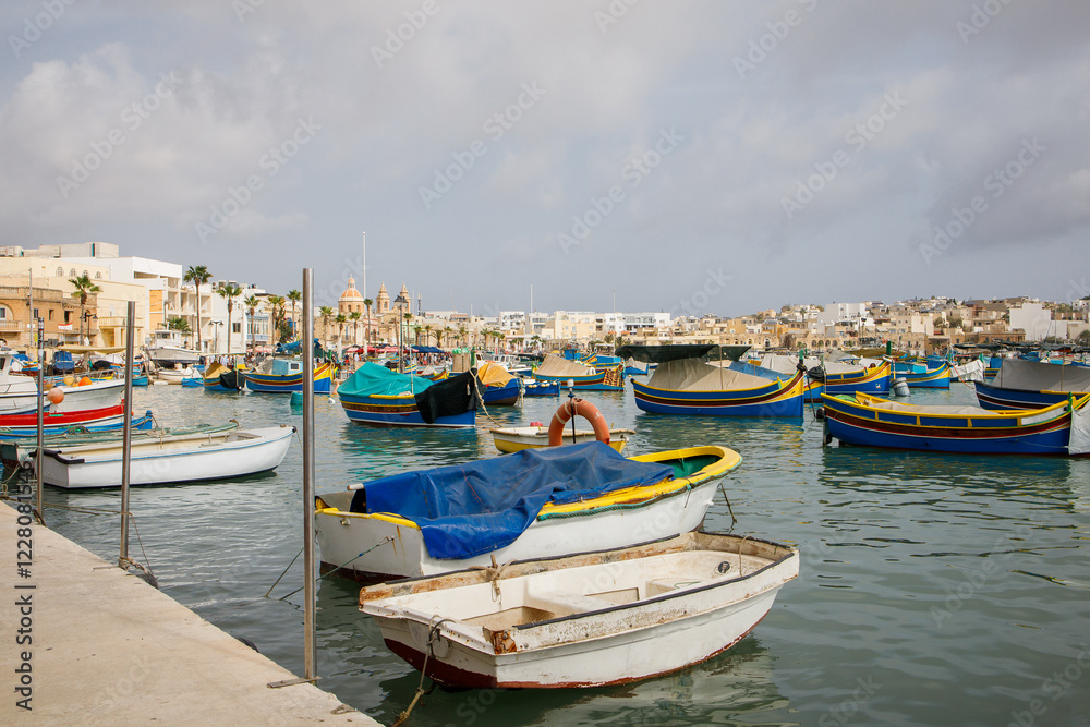 Fishers boats moored in Marsaxlokk bay on Malta Fishers boats moored in Marsaxlokk bay on Malta