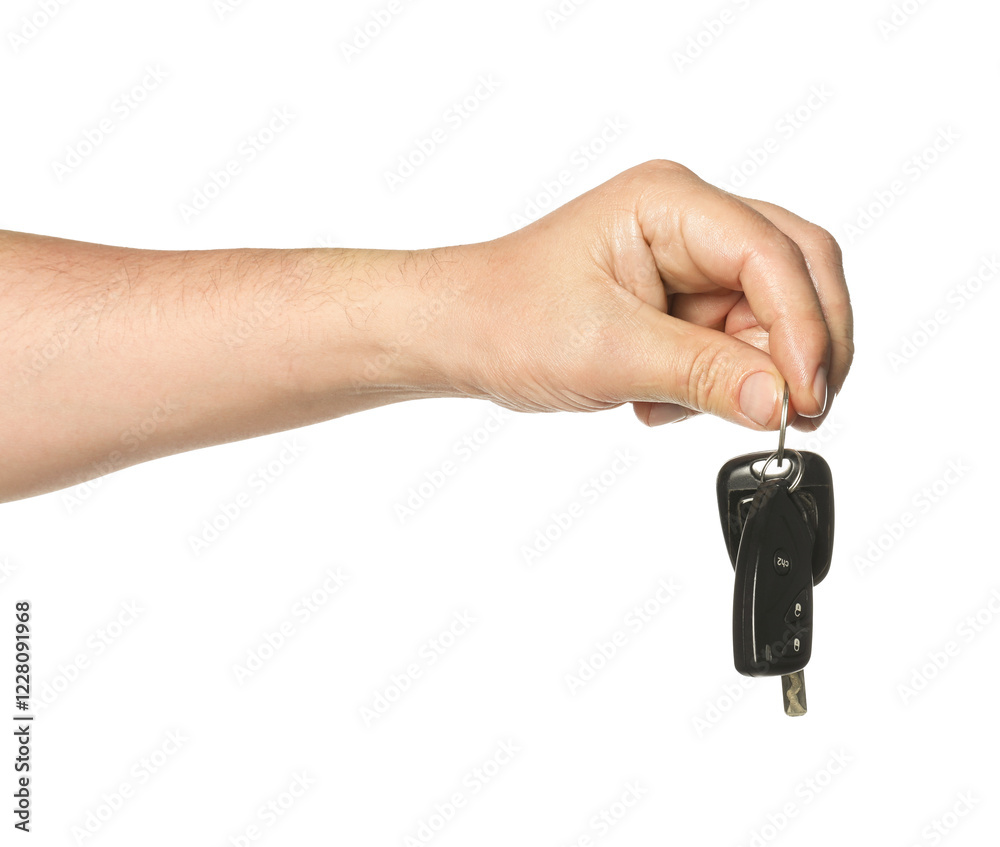 Man with car keys on white background, closeup