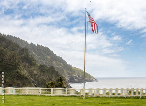 American flag seen at Heceta Beach along the rugged Oregon coastline  photo