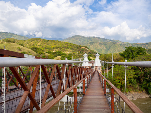 Iconic Wooden Suspension Bridge with Mountain Landscape. Pedestrian Bridge of the West in Antioquia, Colombia connects two towns.