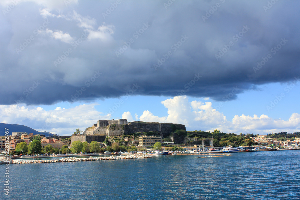 Naklejka premium the old town with the fortress corfu illuminated by the summer sun in greece