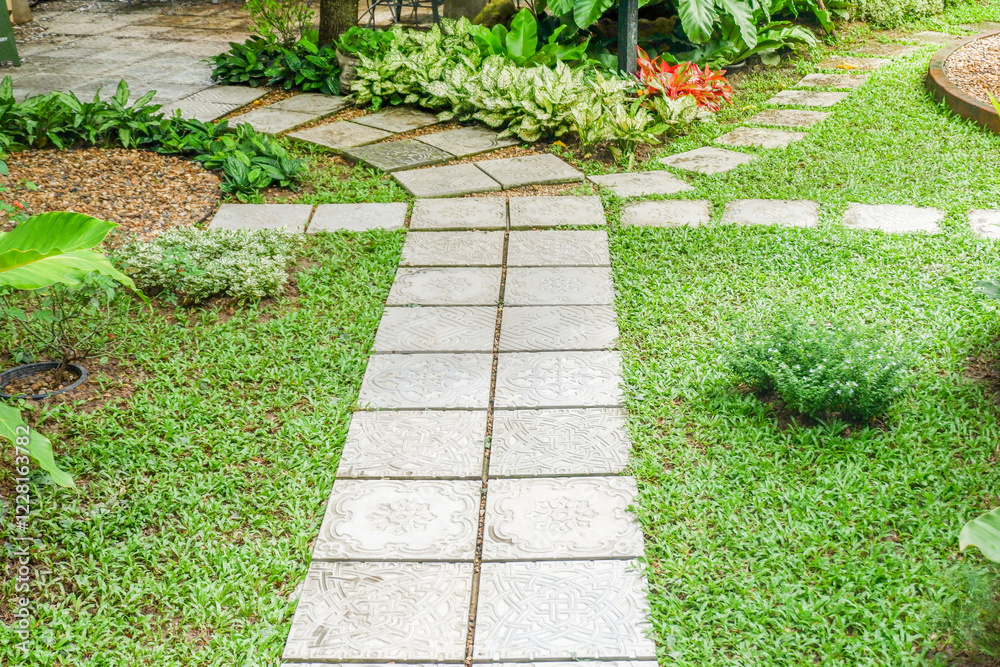 Obraz premium Garden landscape design with pathway in garden and footpath in picturesque summer park and staircase in backyard,Paving stones on floor in park,space for text..