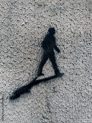 The stencil sihouette of a person walking photo