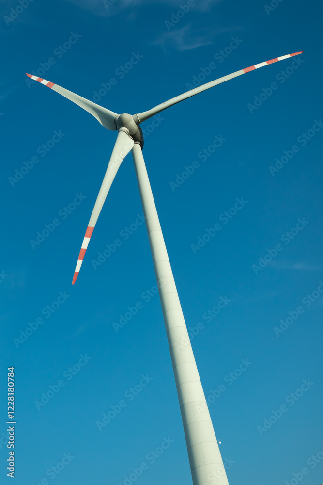 View of windmill against blue sky
