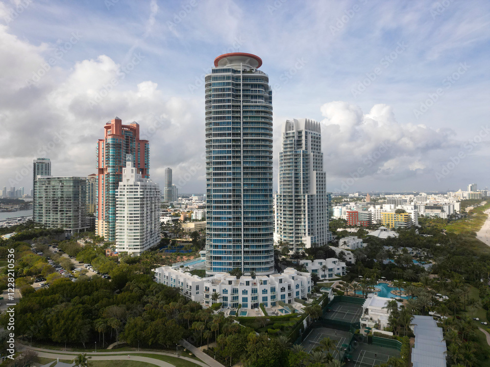 Fototapeta premium Skyscraper architecture of Miami in cloudy weather. Luxurious vacation. Miami South beach landscape aerial view. Aerial Miami skyscraper. Aerial Miami south beach. Cityscape landscape of South Beach